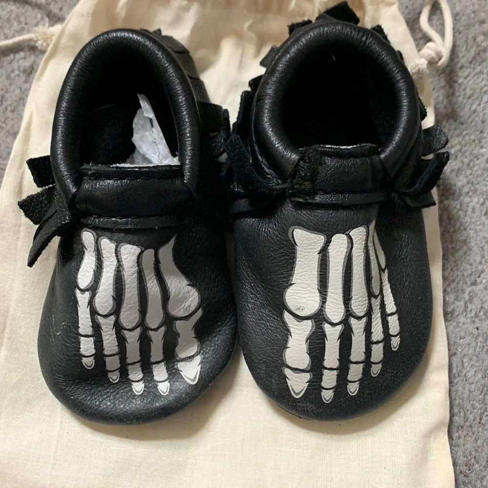 Freshly Picked Black Moccasins with White Skeleton Print